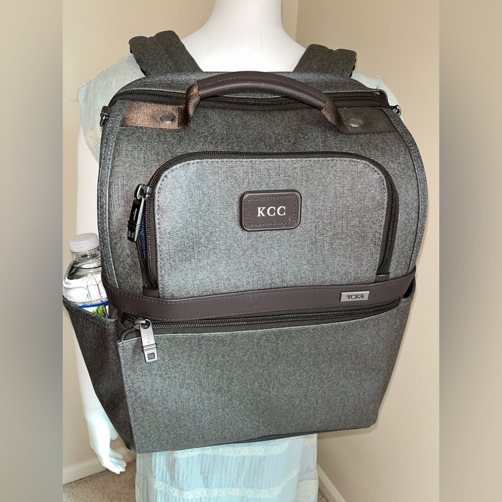 TUMI Backpack in brown 14” wide x 17” tall x 7” deep.